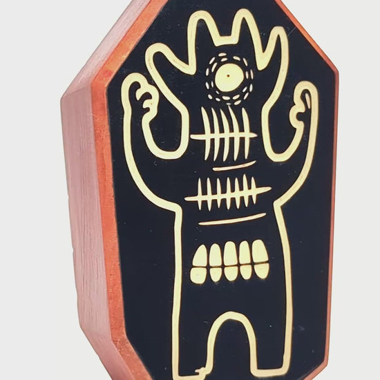 Wooden guardian Glintorb glowing softly and radiating calming soundwaves

