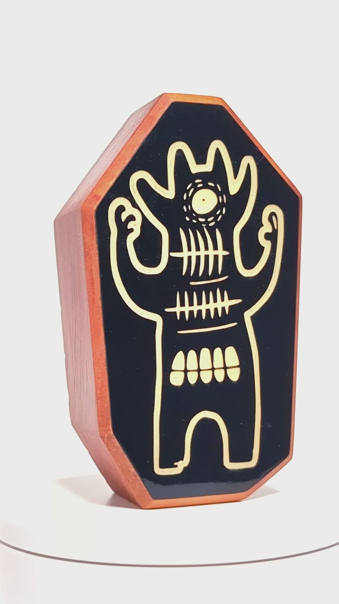 Wooden guardian Glintorb glowing softly and radiating calming soundwaves
