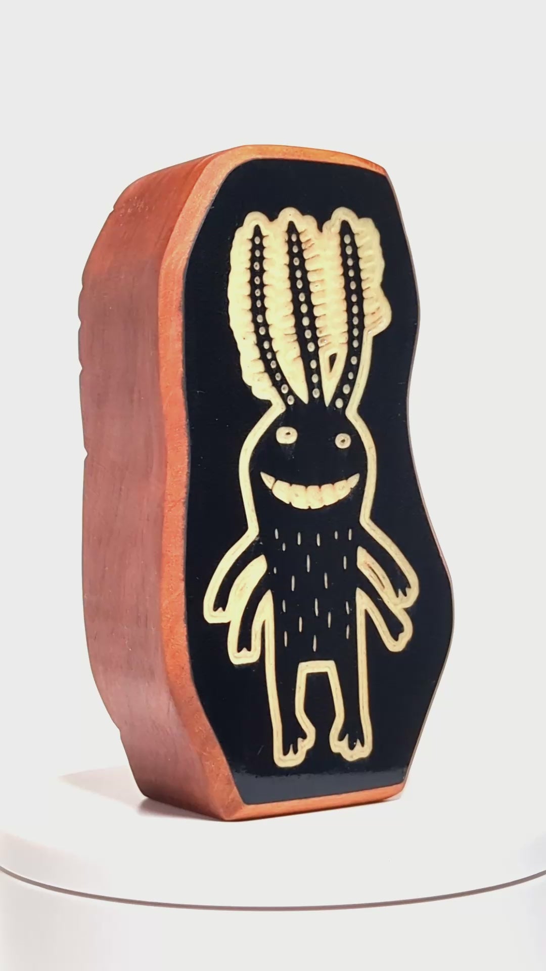 Wooden guardian Fluxoid glowing softly to ward off shadows at night
