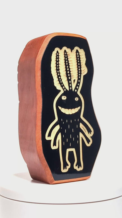 Wooden guardian Fluxoid glowing softly to ward off shadows at night
